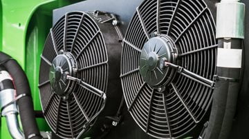 Car driving through the mountains at dusk