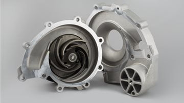 yellow sports car driving down road